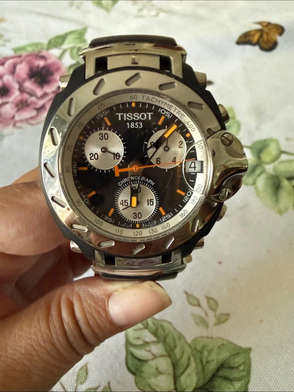 Tissot Black Dial Chronograph Watch with Silver Case and Orange Accents